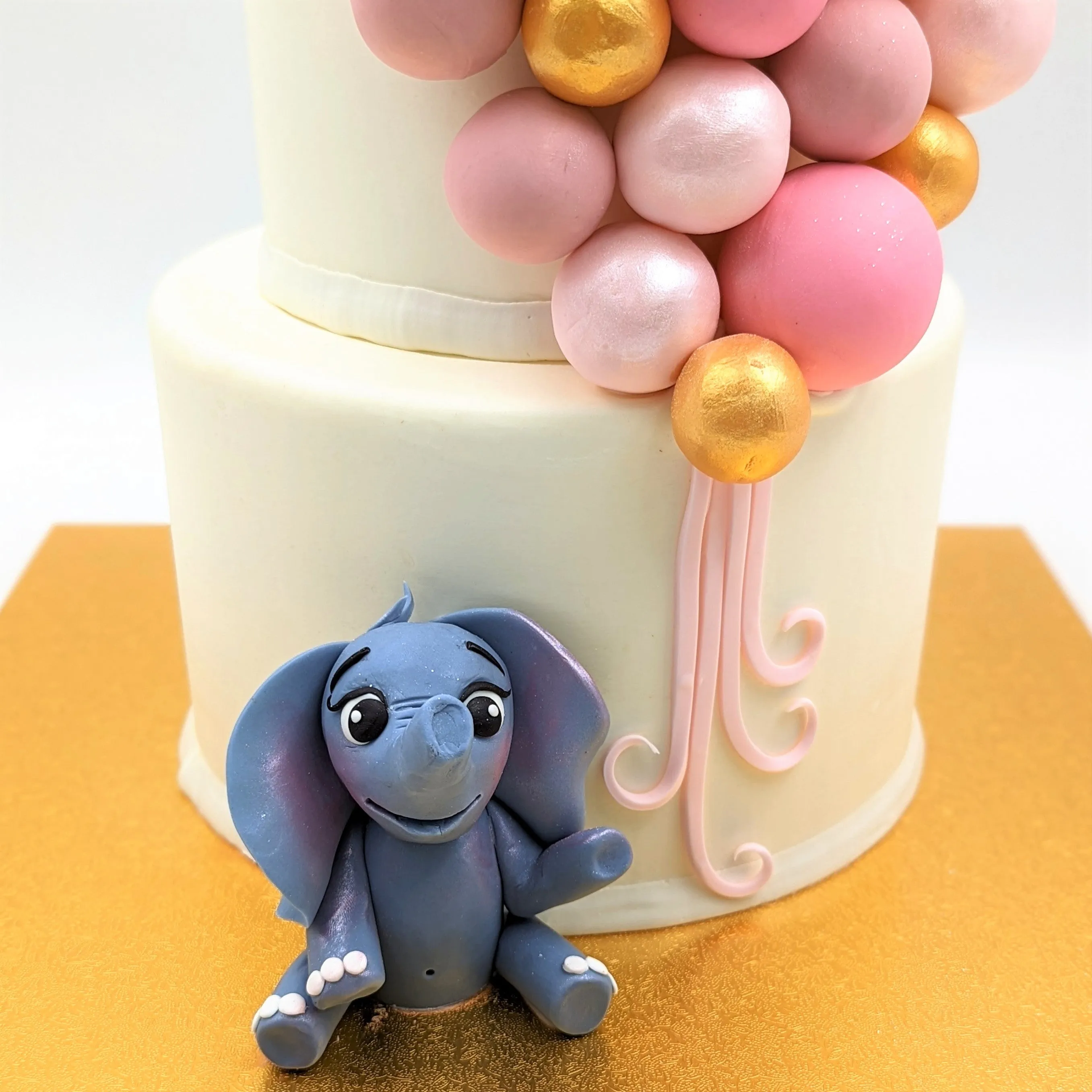 Tiered Balloon Cluster with Elephant